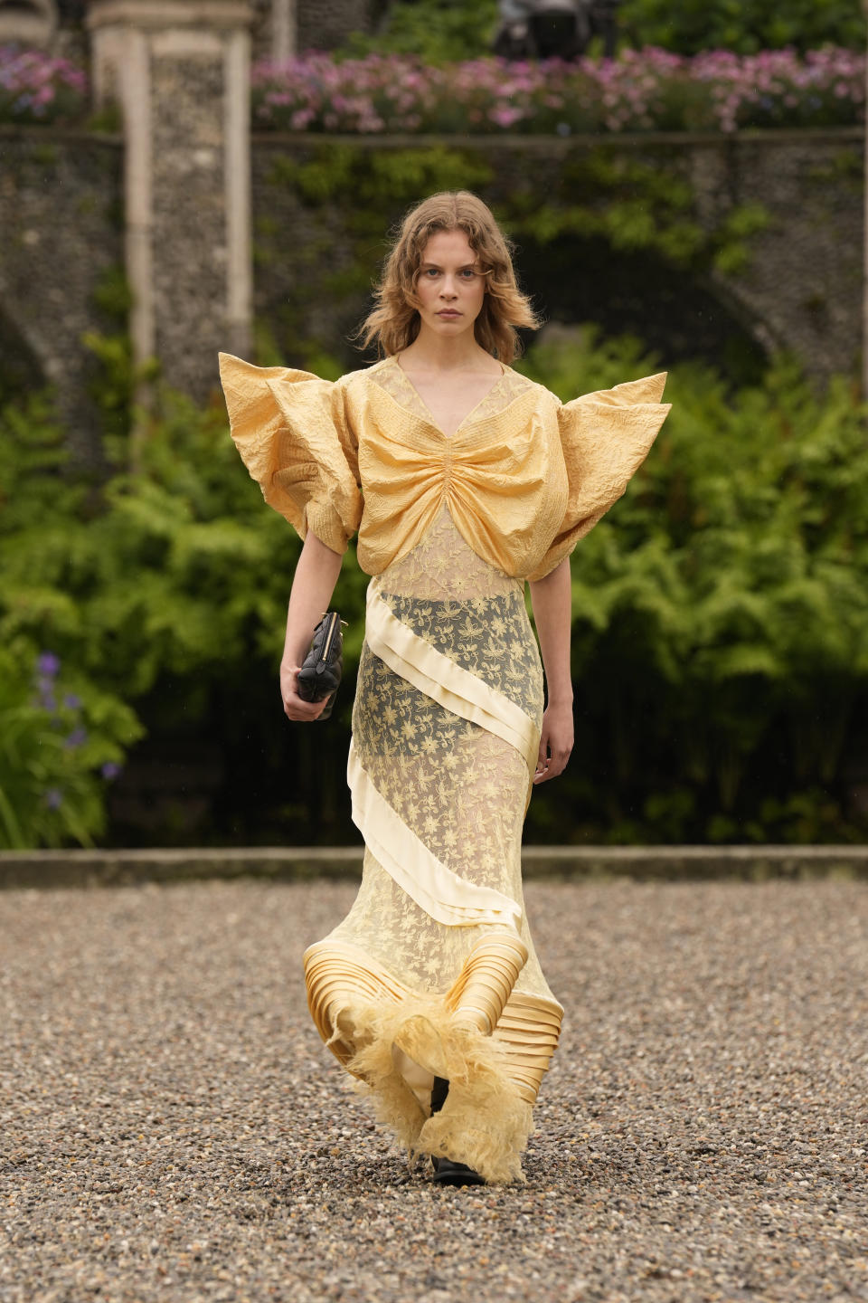 A model wears a creation as part of the women's Louis Vuitton Cruise 2024 collection, unveiled on Isola Bella (Bella Island) on Lake Maggiore in Stresa, northern Italy, Wednesday, May 24, 2023. (AP Photo/Antonio Calanni)