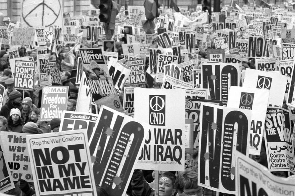 ‘Don’t attack Iraq’: Protesters hold aloft anti-war slogans