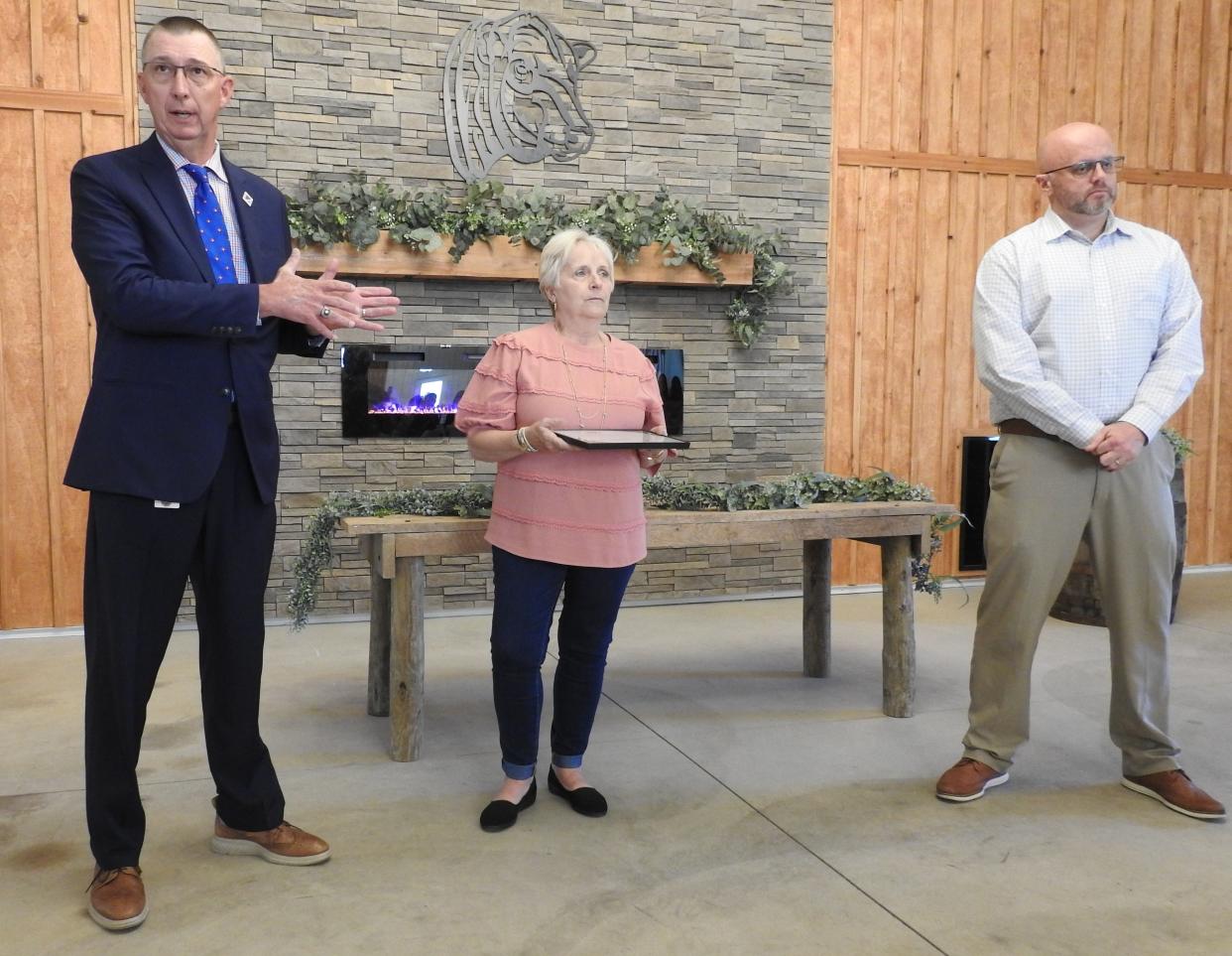 Superintendent Chuck Rinkes, senior project coordinator Cindy Hemming and Principal Joshua Branch of River View High School accept a Community Improvement Award from the Coshocton County Chamber of Commerce for the school's Senior Project program.