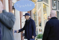 President Joe Biden shakes hands with a person as he visits shops with family members in Nantucket, Mass., Saturday, Nov. 26, 2022. (AP Photo/Susan Walsh)