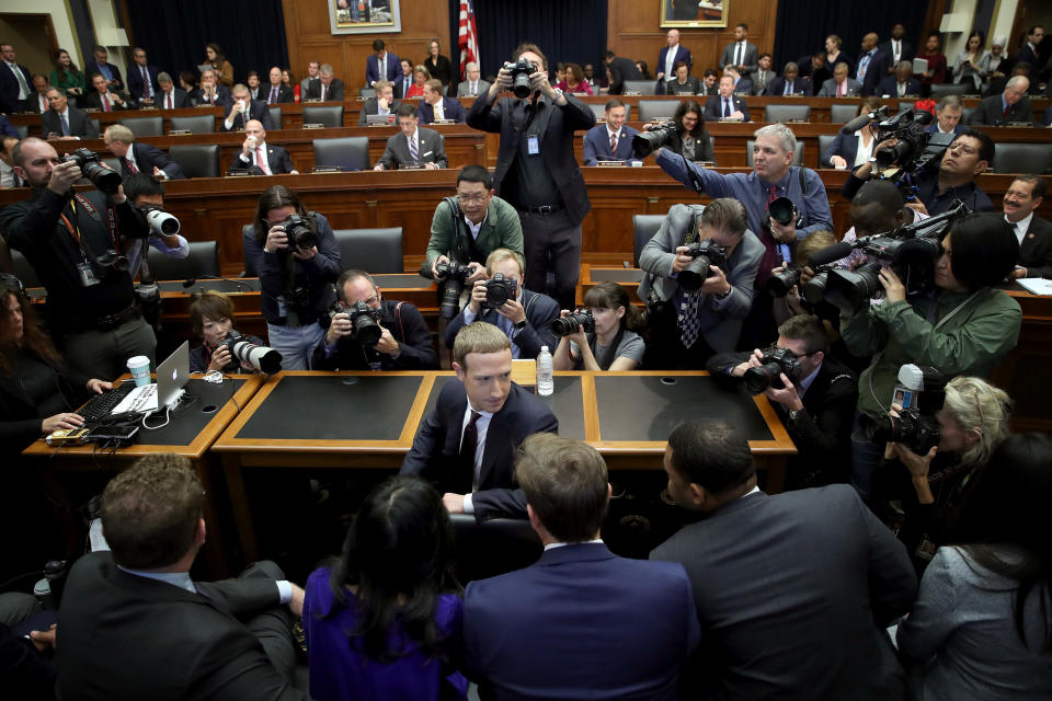 WASHINGTON, DC - OCTOBER 23: Facebook co-founder and CEO Mark Zuckerberg confers with members of his team prior to testimony before the House Financial Services Committee in the Rayburn House Office Building on Capitol Hill October 23, 2019 in Washington, DC. Zuckerberg testified about Facebook's proposed cryptocurrency Libra, how his company will handle false and misleading information by political leaders during the 2020 campaign and how it handles its users’ data and privacy. (Photo by Win McNamee/Getty Images)