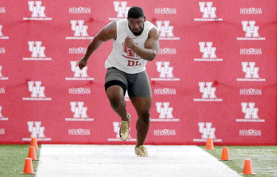 Houston defensive lineman Ed Oliver Jr. participates in drills during his pro day (AP Photo)