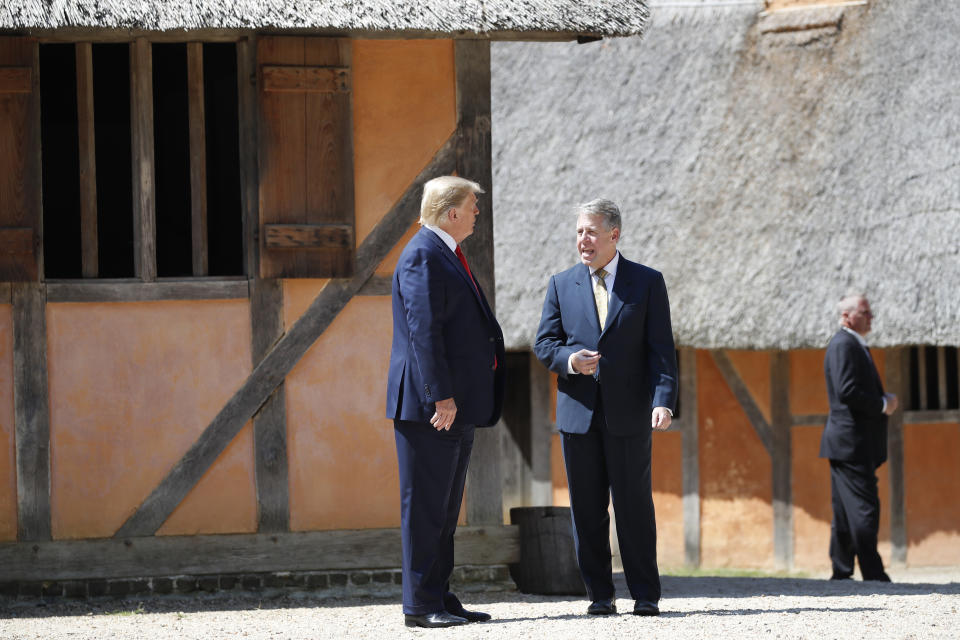 President Donald Trump tours the old Jamestown Settlement with Jamestown-Yorktown Foundation executive director Philip Emerson, Tuesday, July 29, 2019, in Jamestown, Va. (AP Photo/Alex Brandon)