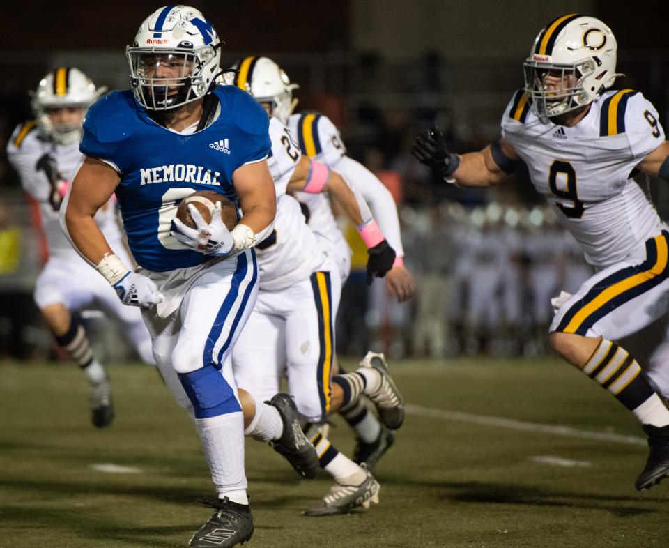 Memorial’s Porter Rode (6) runs the ball as the Memorial Tigers play the Castle Knights at Enlow Field in Evansville, Ind., Friday evening, Oct. 14, 2022. 