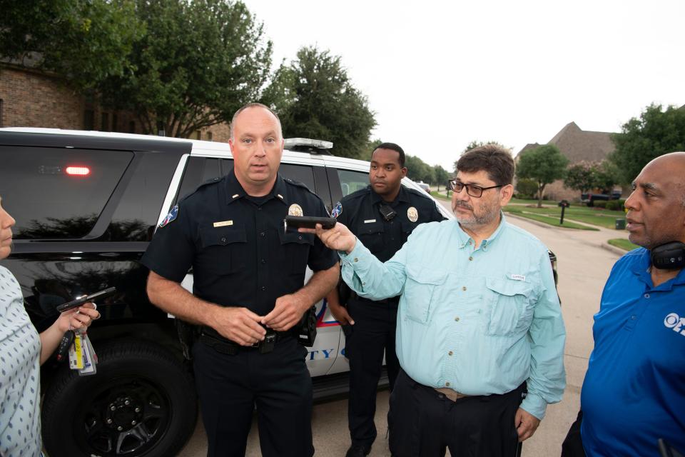 Allen Police Lt. Kris Wirstrom is interviewed after Allen police and FBI gather evidence Sunday, Aug. 4, 2019, from the Allen, Texas, home of the suspected gunman in the El Paso Walmart shooting.