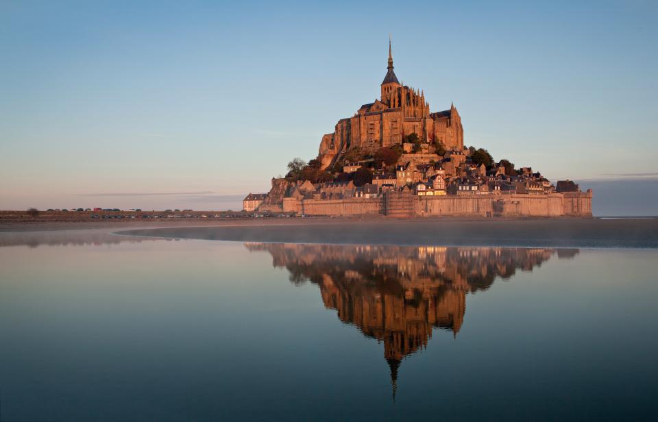 The tidal island of Mont Saint-Michel on the Normandy coast at sunrise, taken on October 15, 2011. (Photo by Jeff Morgan/PhotoPlus Magazine via Getty Images)