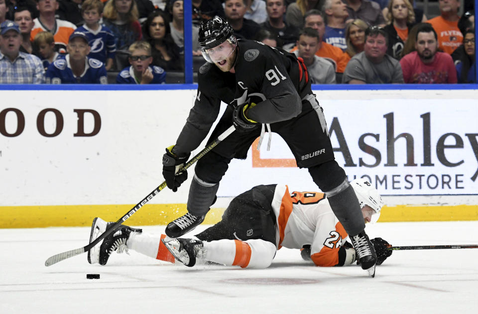 Tampa Bay Lightning center Steven Stamkos (91) looks for shot during the second period of an NHL hockey game against the Philadelphia Flyers, Saturday, Feb. 15, 2020, in Tampa, Fla. (AP Photo/Jason Behnken)