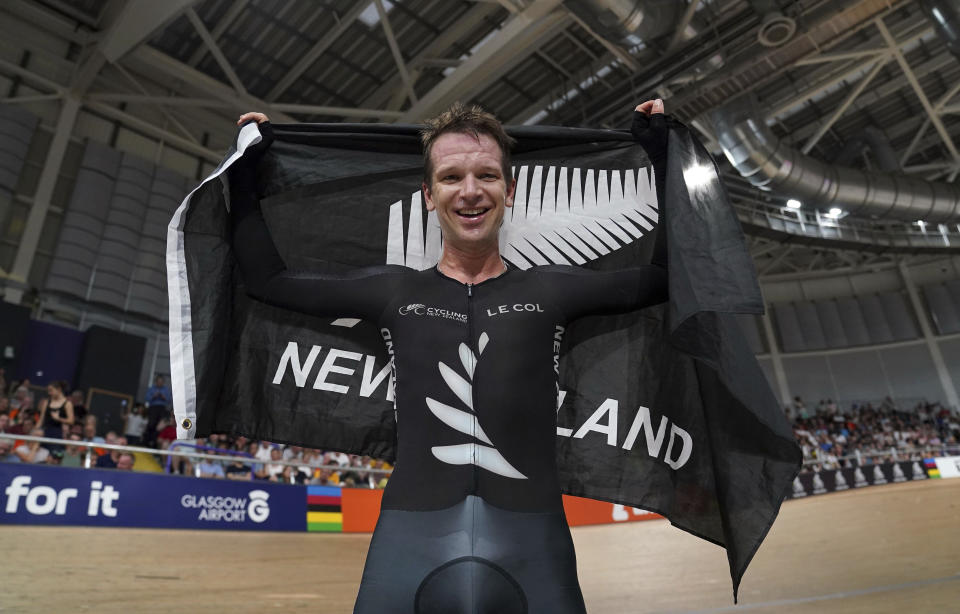 New Zealand's Aaron Gate celebrates winning the Men's Elite Points Race during day seven of the 2023 UCI Cycling World Championships at the Sir Chris Hoy Velodrome, Glasgow, Scotland, Wednesday, Aug. 9, 2023. (Tim Goode/PA via AP)