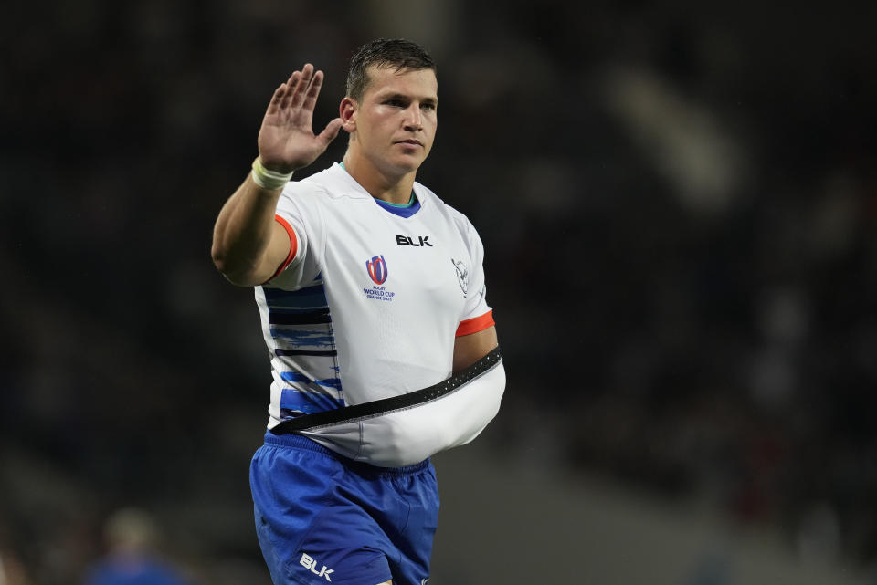 Namibia's Adriaan Booysen waves after the Rugby World Cup Pool A match between New Zealand and Namibia at the Stadium de Toulouse in Toulouse, France, Friday, Sept. 15, 2023. New Zealand won 71-3. (AP Photo/Themba Hadebe)