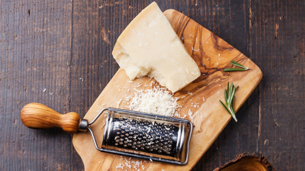 Parmesan Cheese With Grater Stock Photo - Download Image Now