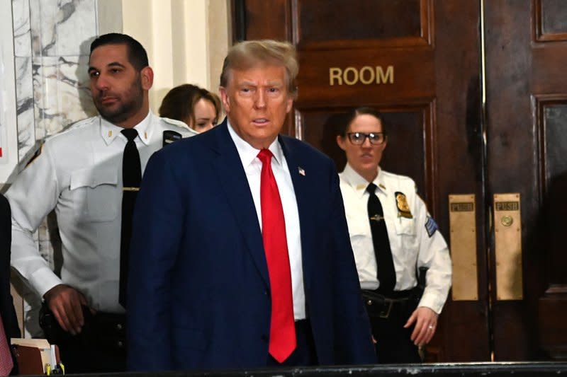 Former President Donald Trump enters the courtroom in his civil fraud trial at State Supreme Court in New York on Thursday for closing arguments. Photo by Louis Lanzano/UPI