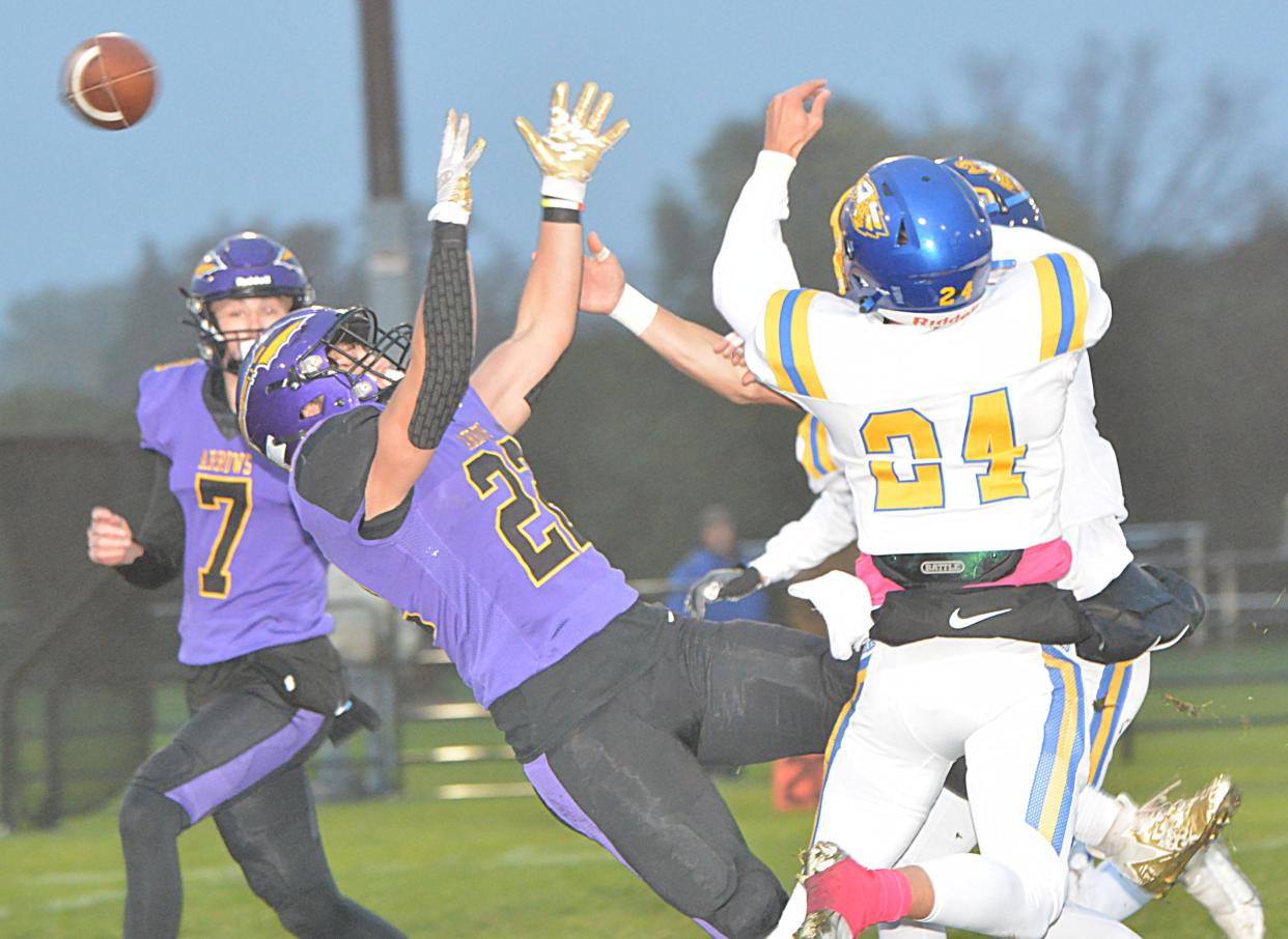 Watertown's Mitch Olson (7) and Spencer Wientjes watch a pass play being broken up by Aberdeen Central's Cordel Rychlik during their first-round game in the state Class 11AA high school football playoffs on Thursday, Oct. 26, 2023 at Watertown Stadium.