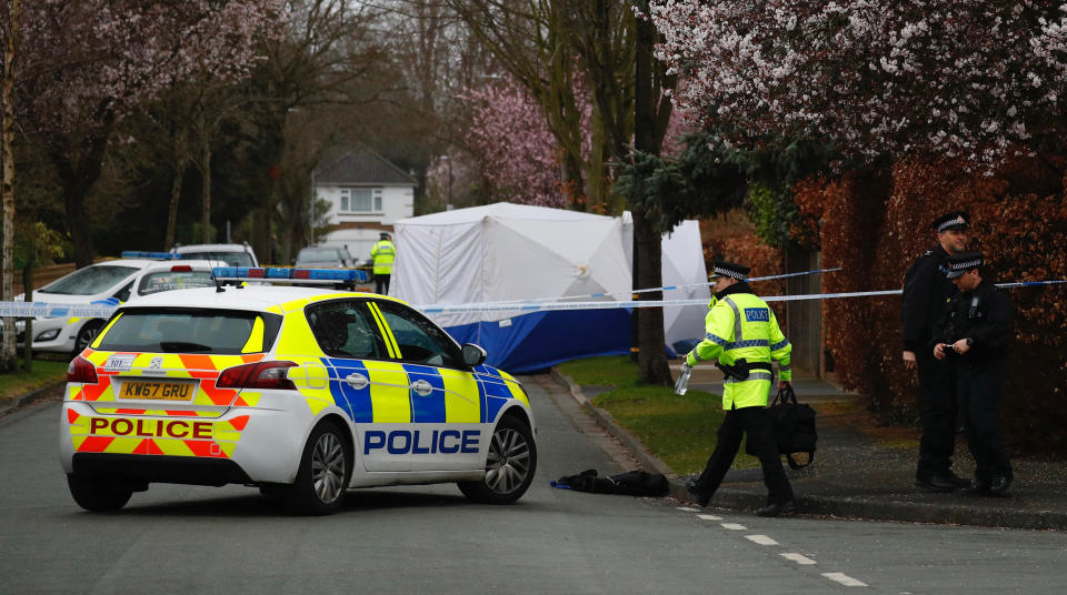 Police at the scene on Gorse Bank Road in the village of Hale Barns, near Altrincham, following the stabbing of a 17-year-old boy who later died in hospital. Police have been granted more time to question two 17-year-old boys arrested on suspicion of murder. (PA)