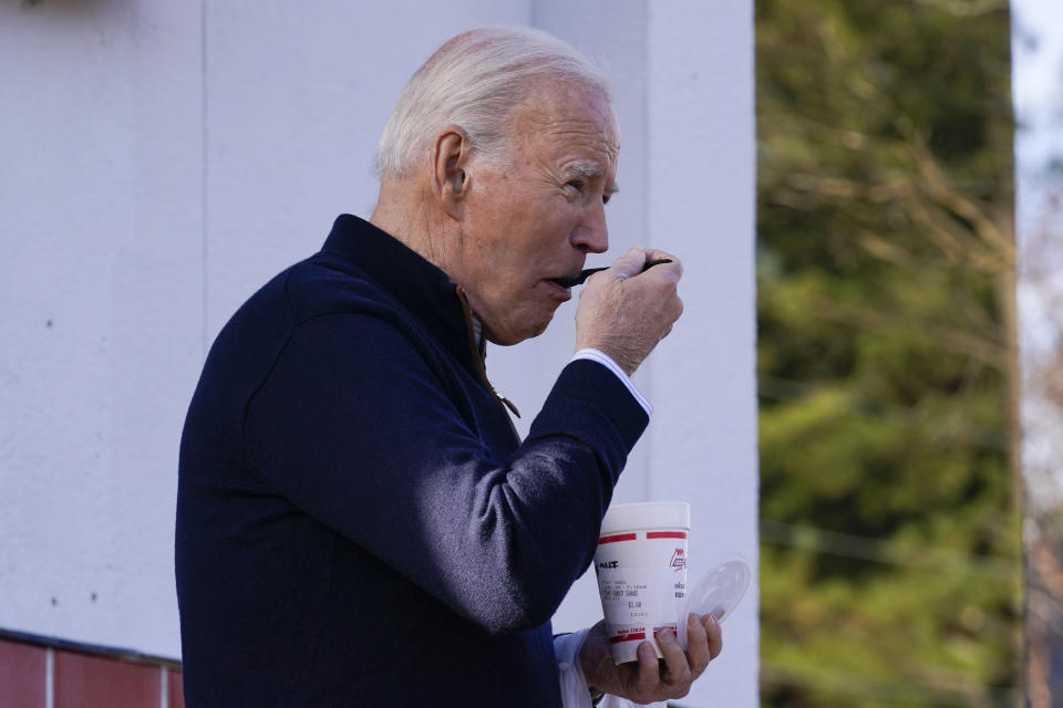 FILE - President Joe Biden eats a milk shake from Cook Out, a burger place in Raleigh, N.C., Jan. 18, 2024. Biden is going small to try to win big in November. With 10 months to go until Election Day, the Democratic incumbent is all in on minimalist events — visits to a boba tea store, a family's kitchen and a barbershop, for example — rather than big rallies. (AP Photo/Manuel Balce Ceneta, File)