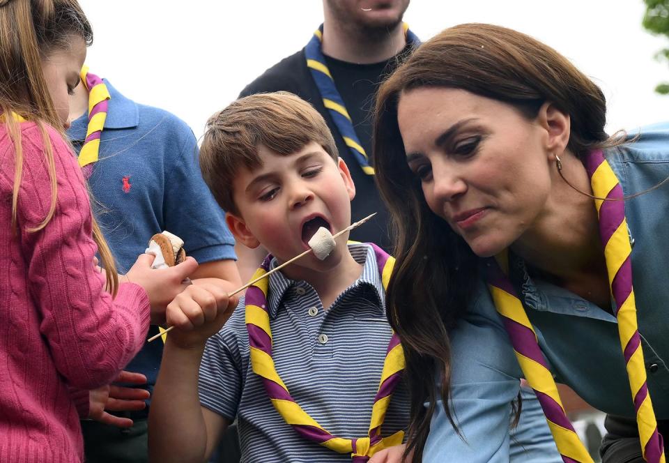 london, england may 08 prince louis of wales and catherine, princess of wales toast marshmallows as they take part in the big help out, during a visit to the 3rd upton scouts hut in slough on may 8, 2023 in london, england the big help out is a day when people are encouraged to volunteer in their communities it is part of the celebrations of the coronation of charles iii and his wife, camilla, as king and queen of the united kingdom of great britain and northern ireland, and the other commonwealth realms that took place at westminster abbey on saturday, may 6, 2023 photo by daniel leal wpa poolgetty images