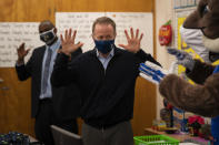 Los Angeles Unified School District Superintendent Austin Beutner participates in a classroom activity on the first day of in-person learning at Heliotrope Avenue Elementary School in Maywood, Calif., Tuesday, April 13, 2021. More than a year after the pandemic forced all of California's schools to close classroom doors, some of the state's largest school districts are slowly beginning to reopen this week for in-person instruction. (AP Photo/Jae C. Hong)