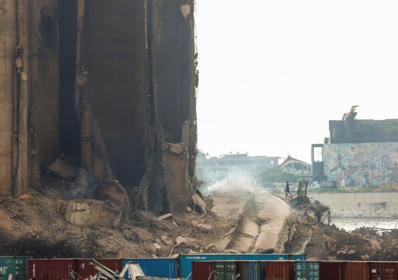 Dust rises as part of Beirut grain silos, damaged in the August 2020 port blast, collapses in Beirut