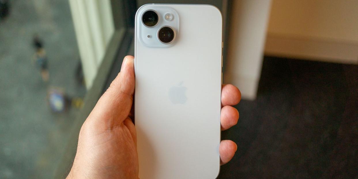 iphone 15 from the back held in a hand