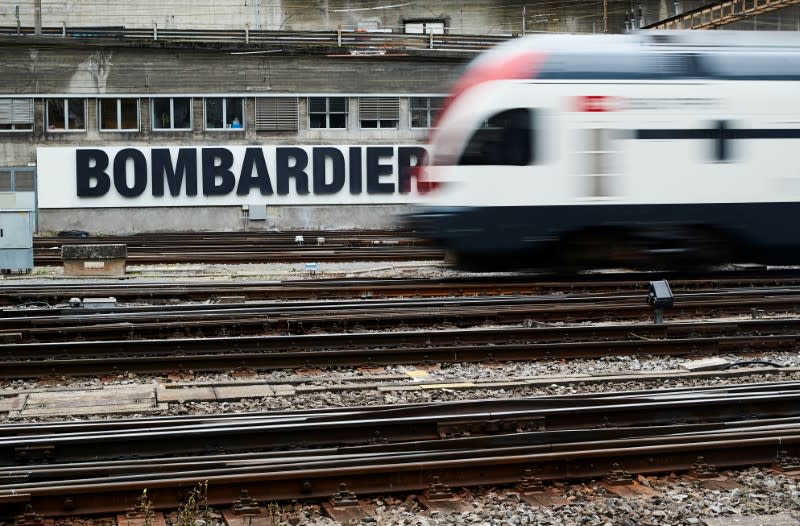 FILE PHOTO: A Bombardier advertising board is pictured in front of a SBB CFF Swiss railway train at the station in Bern