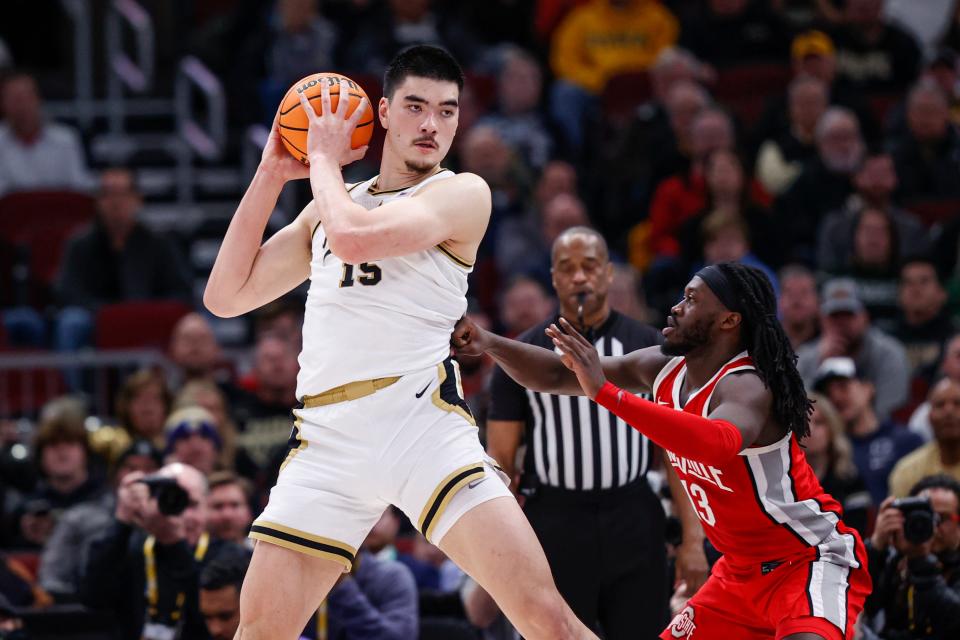 Mar 11, 2023; Chicago, IL, USA; Purdue Boilermakers center Zach Edey (15) is defended by Ohio State Buckeyes guard Isaac Likekele (13) during the first half at United Center. Mandatory Credit: Kamil Krzaczynski-USA TODAY Sports