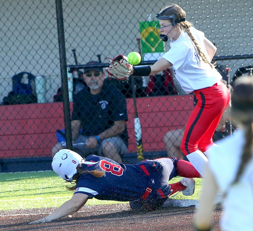 Bedford North Lawrence's Sara Williams (8) slides safely into third as the Barr-Reeve first baseman loses the handle on the ball on Monday, April 29, 2024. BNL prevailed in its home matchup with Barr-Reeve 5-2. BNL also played Thursday when they hosted HHC rival Jennings County.