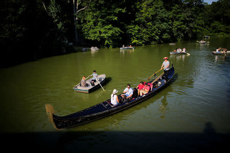 People enjoy the day out on boats during a hot summer day in Central Park, Manhattan, New York, U.S., July 1, 2018. REUTERS/Eduardo Munoz