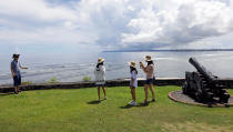 <p>South Korean tourists stroll outside the Governor’s Complex on the island of Guam, a U.S. Pacific Territory, August 10, 2017. (Erik De Castro/Reuters) </p>