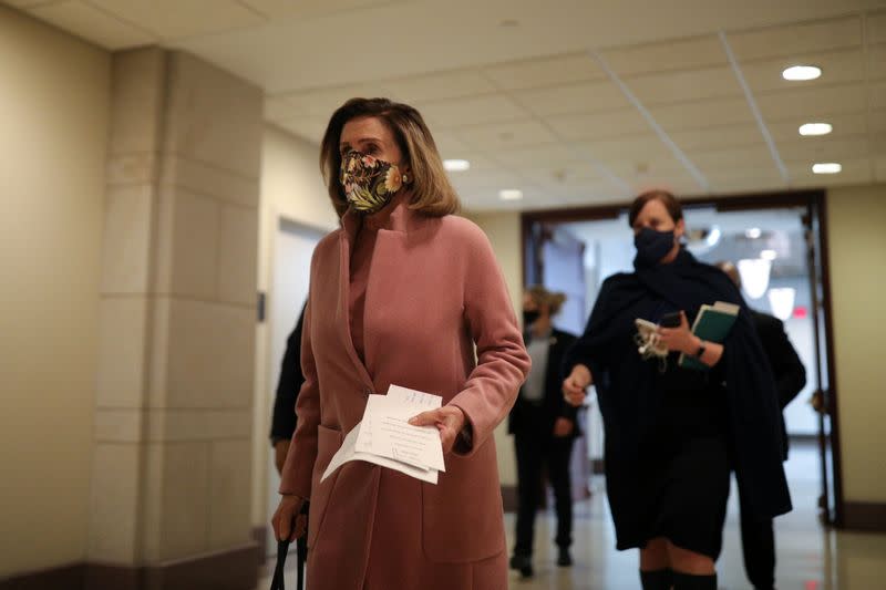 Speaker of the House Pelosi walks to a news conference on Capitol Hill in Washington