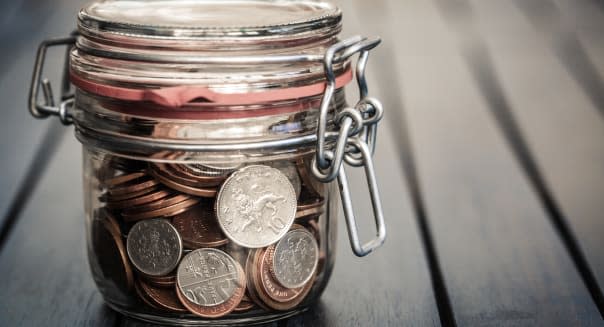 Coins secured in glass jar