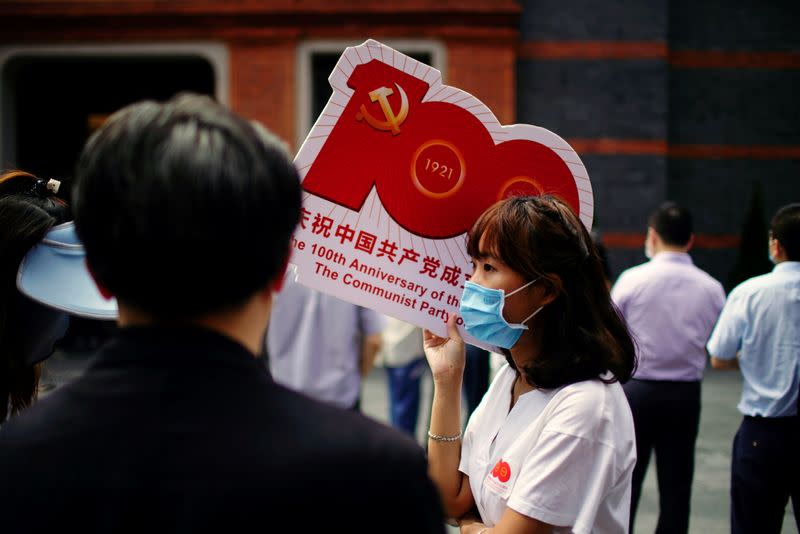 People attend an event marking the 100th founding anniversary of the Communist Party of China, in Shanghai
