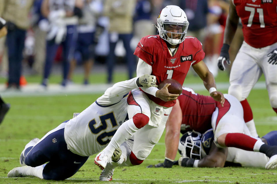 Arizona Cardinals quarterback Kyler Murray (1) is tackled by Los Angeles Rams outside linebacker Samson Ebukam (50) during the second half of an NFL football game, Sunday, Dec. 1, 2019, in Glendale, Ariz. (AP Photo/Ross D. Franklin)