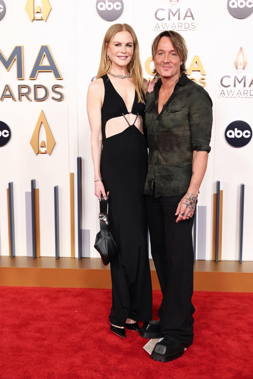 Nicole Kidman, Keith Urban, heels, high heels, black heels, pumps, pointed toe heels, leather heels, embossed heels, embossed pumps, stilettos, stiletto heels, cutout dress, ring dress, black dress, boots, black boots, Balenciaga boots CMA Awards, CMA Awards 2023, Country Music Association, country music, music, musicians, awards, awards shows, red carpet, celebrity red carpet