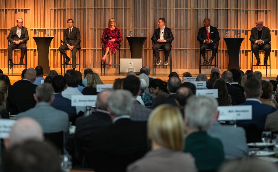 Six of the eight governor candidates participate in answering questions Friday, Dec. 8, 2023, during an Indiana Governor candidate forum at The Commons on Washington Street in Columbus.