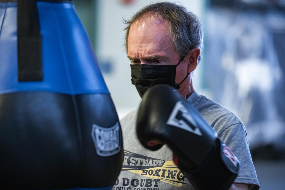 Jon Roberts wears a mask while working out at Rock Steady Boxing in Las Cruces on Friday, Dec. 17, 2021.