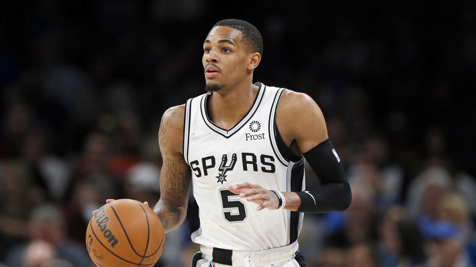 San Antonio Spurs guard Dejounte Murray in the first half of an NBA basketball game Wednesday, Feb. 16, 2022, in Oklahoma City. (AP Photo/Nate Billings)