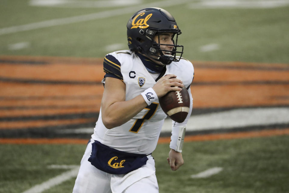 California quarterback Chase Garbers (7) rolls out to throw the ball during the second half of an NCAA college football game against Oregon State in Corvallis, Ore., Saturday, Nov. 21, 2020. Oregon State won 31-27. (AP Photo/Amanda Loman)
