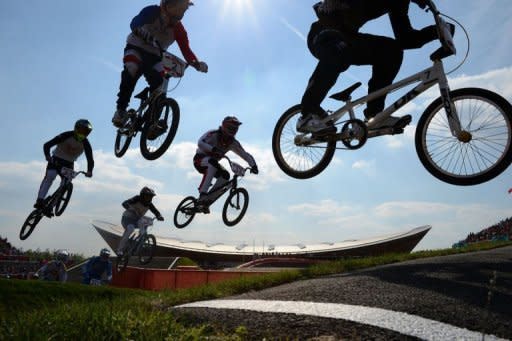 Australia's Marc Willers (R), Switzerland's Roger Rinderknecht (C, #13), Joris Daudet (Upper #2) of France, Nicholas Long of the US (L,#64) and compatriot David Herman (lower, 2nd L, #5) compete during the men's BMX cycling heat at the London 2012 Olympic Games, in London on August 9, 2012