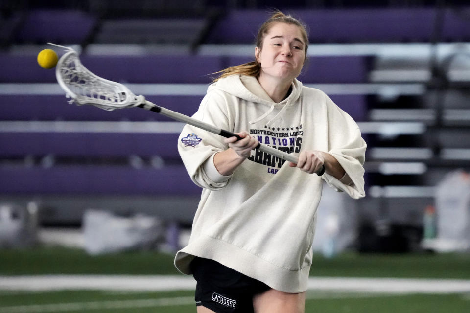 Northwestern's Izzy Scane warms up during the lacrosse team's practice in Evanston, Ill., Tuesday, Feb. 6, 2024. (AP Photo/Nam Y. Huh)