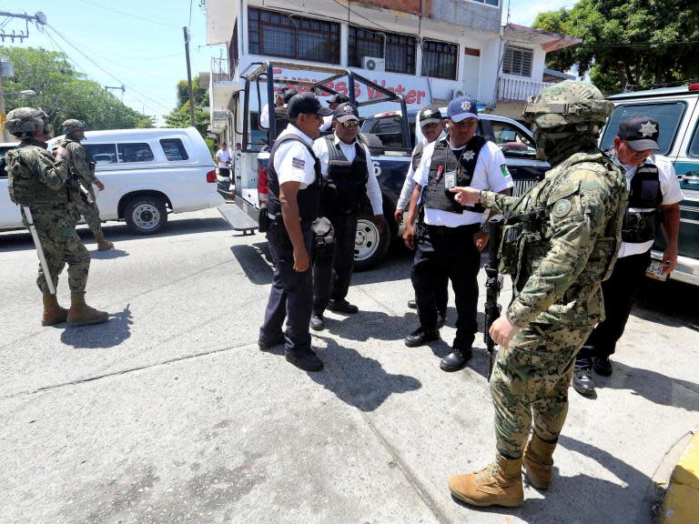 Mexican military disarm entire police force in resort city of Acapulco 'corrupted by drug gangs'