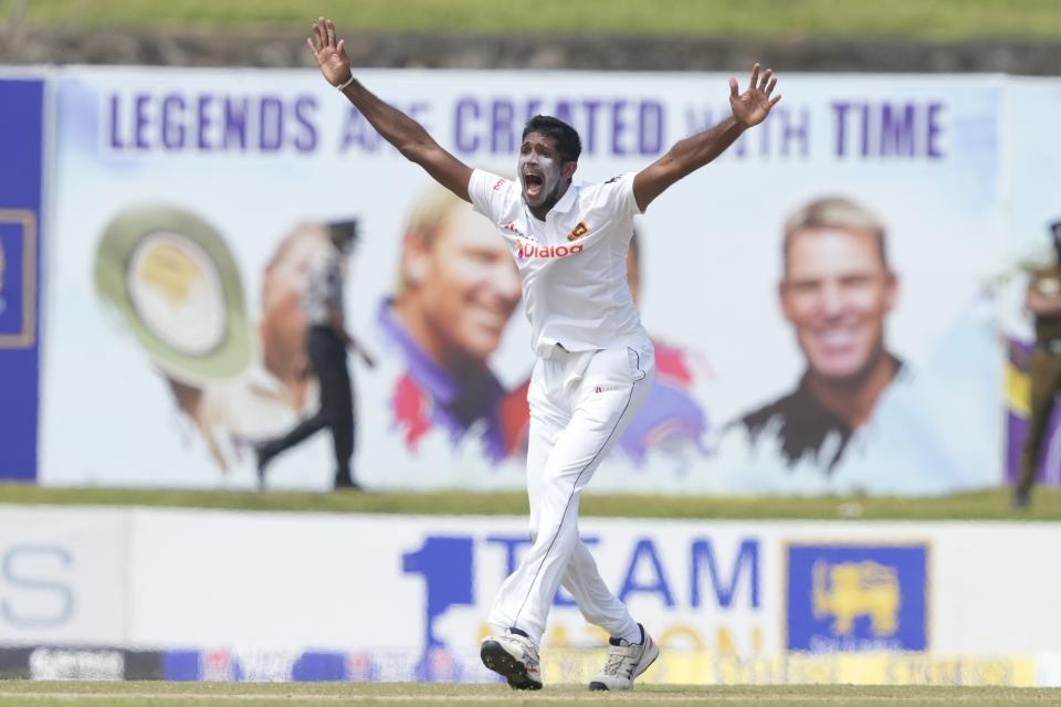 Sri Lanka's Kasun Rajitha successfully appeals to dismiss Australia's Pat Cummins during the second day of the second test cricket match between Australia and Sri Lanka in Galle, Sri Lanka, Saturday, July 9, 2022. (AP Photo/Eranga Jayawardena)