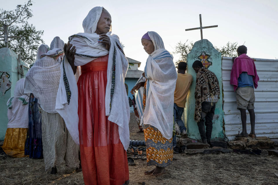 Tigrayan women who fled the conflict in Ethiopia's Tigray region, arrive for Sunday Mass at a church, near Umm Rakouba refugee camp in Qadarif, eastern Sudan, Nov. 29, 2020. (AP Photo/Nariman El-Mofty)