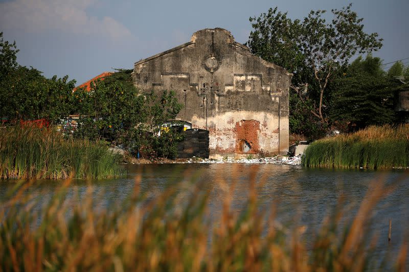 A damaged house affected by land subsidence is pictured near the coastal area of Semarang in Central Java province