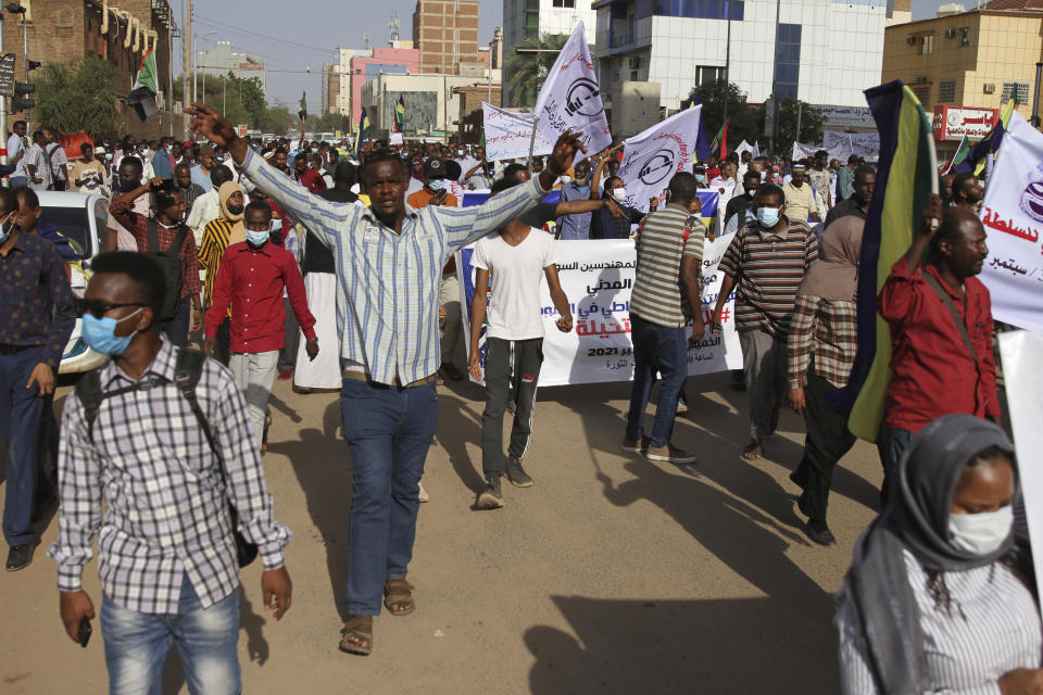 Sudanese participate in a demonstration, in Khartoum, Sudan, Thursday, Sept. 30, 2021. Thousands of Sudanese rallied in the capital of Khartoum against the country's military and demanding the formation of new transitional authorities that would exclusively consist of civilians. Thursday's demonstration accused the generals of derailing the country’s transition to democracy. (AP Photo/Marwan Ali)