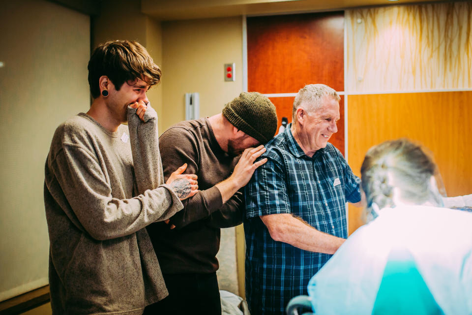 Elliot Dougherty, Matthew Eledge and Kirk Eledge share an emotional moment during Uma's delivery. (Photo: <a href="https://www.instagram.com/arielpanowicz/?hl=en" target="_blank">Ariel Panowicz</a>)