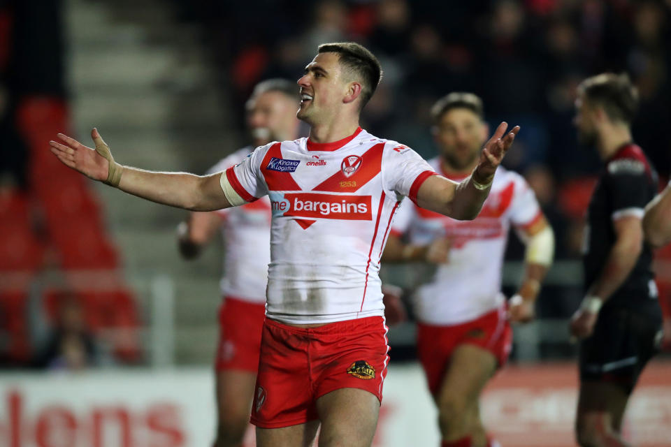 ST HELENS, ENGLAND - MARCH 08: Lewis Dodd of St.Helens celebrates after scoring his team's fourth try during the Betfred Super League match between St Helens and Salford Red Devils at Totally Wicked Stadium on March 08, 2024 in St Helens, England. (Photo by Jess Hornby/Getty Images)
