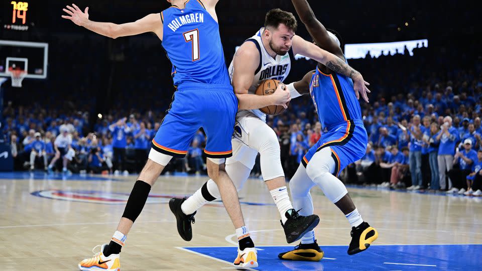 Dončić drives to the basket during the game. - Joshua Gateley/Getty Images