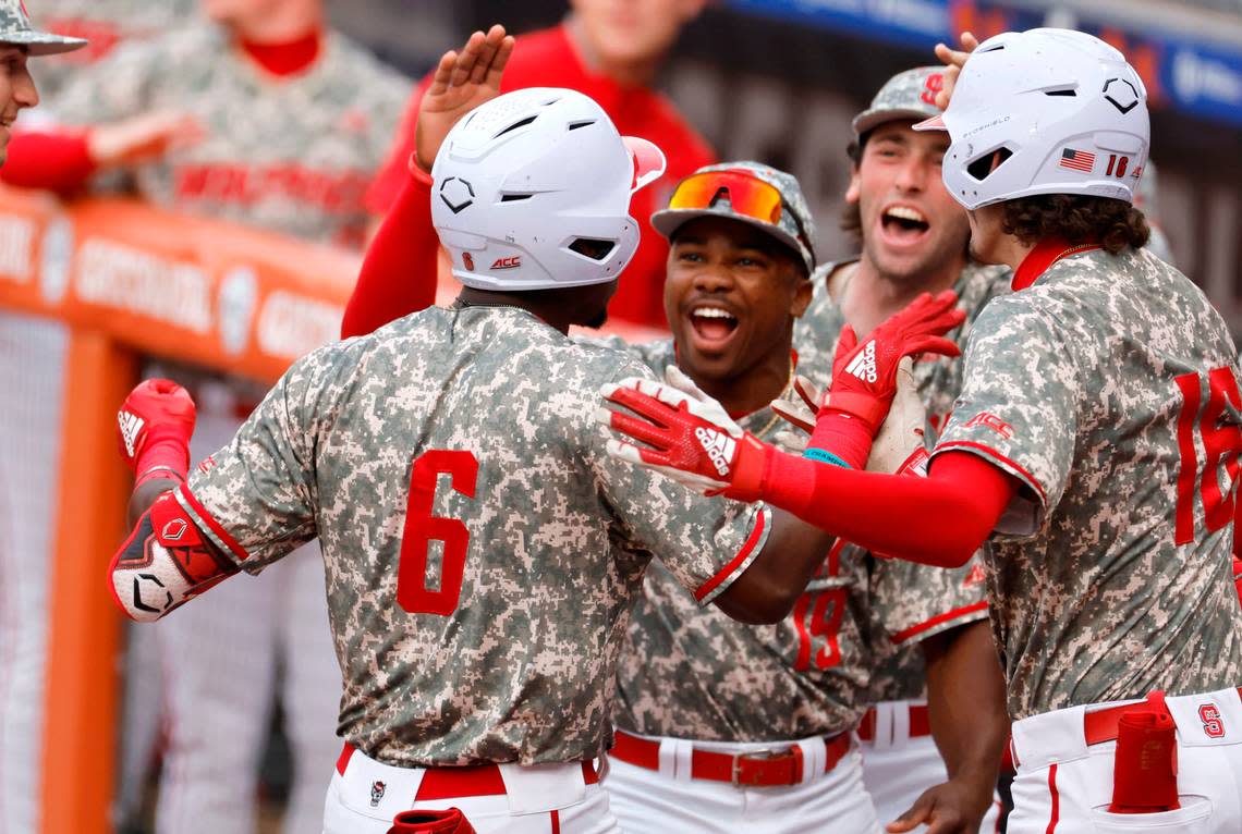 N.C. State’s LuJames Groover III (6) celebrates with teammates after hitting a two-run home run in the first inning during Duke’s game against N.C. State in the ACC Baseball Championship at the Durham Bulls Athletic Park in Durham, N.C., Tuesday, May 23, 2023.