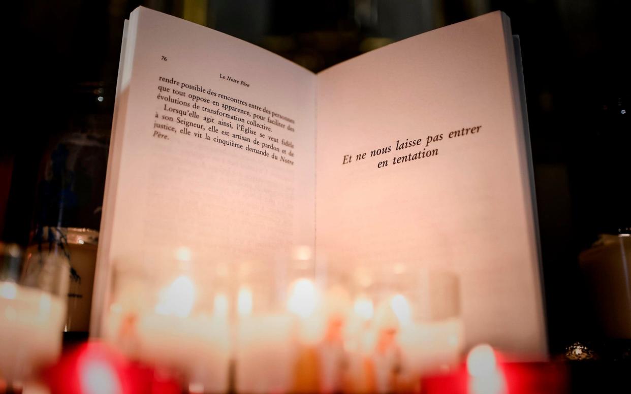 The modified sentence in the new version of the Lord's Prayer at the Notre-Dame-des-Victoires basilica in Paris - AFP