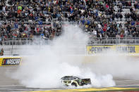William Byron does a burnout after winning a NASCAR Cup Series auto race on Sunday, March 5, 2023, in Las Vegas. (AP Photo/Ellen Schmidt)