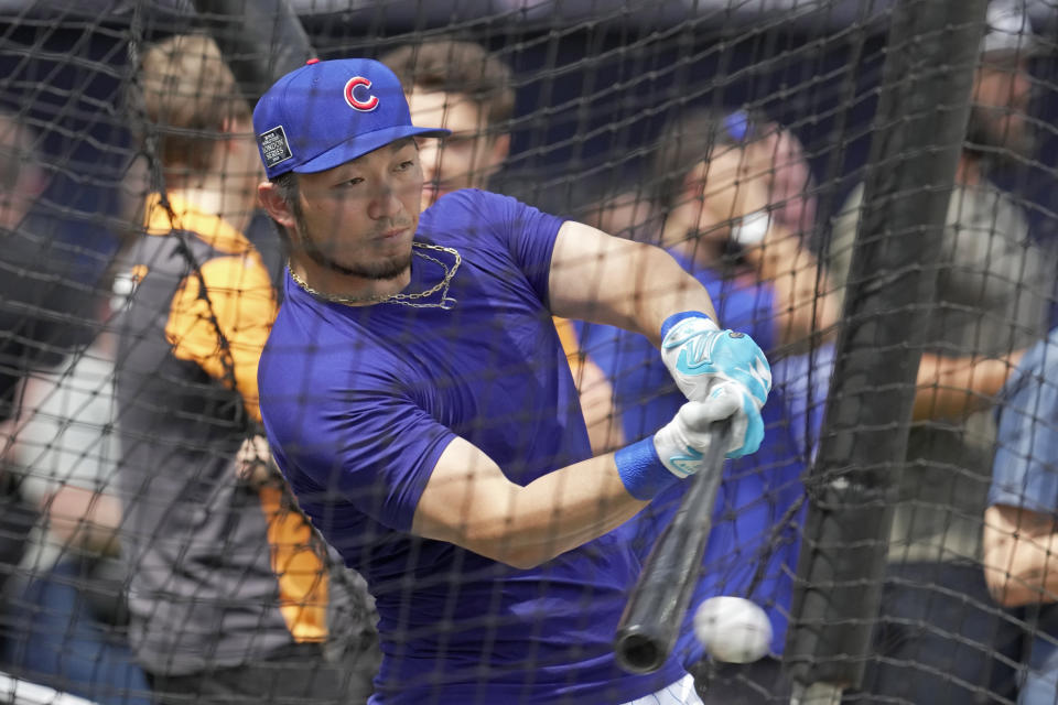 Chicago Cubs' Seiya Suzuki practices during a training session ahead of the baseball match against St. Louis Cardinals at the MLB World Tour London Series, in London Stadium. (AP Photo/Kin Cheung)